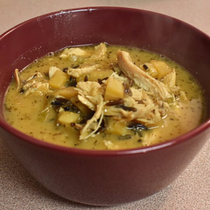 best ever creamy chicken and wild rice soup in a red bowl