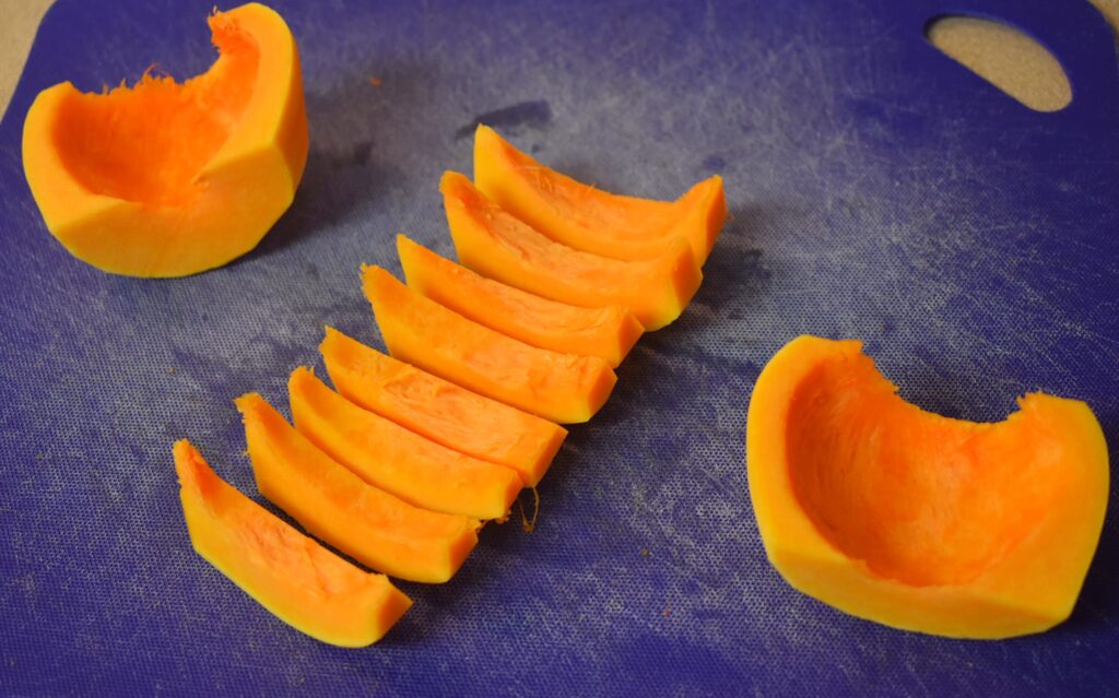 seed belly of butternut squash cut in half and sliced in strips