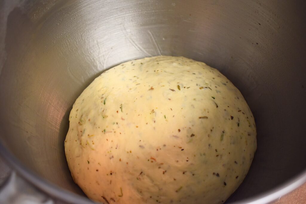 italian herb bread dough doubled in size in mixing bowl