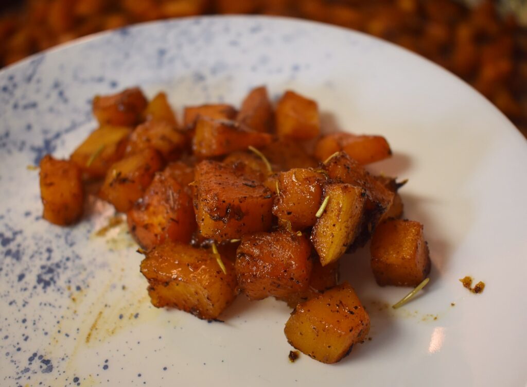 maple glazed roasted butternut squash on white and blue plate