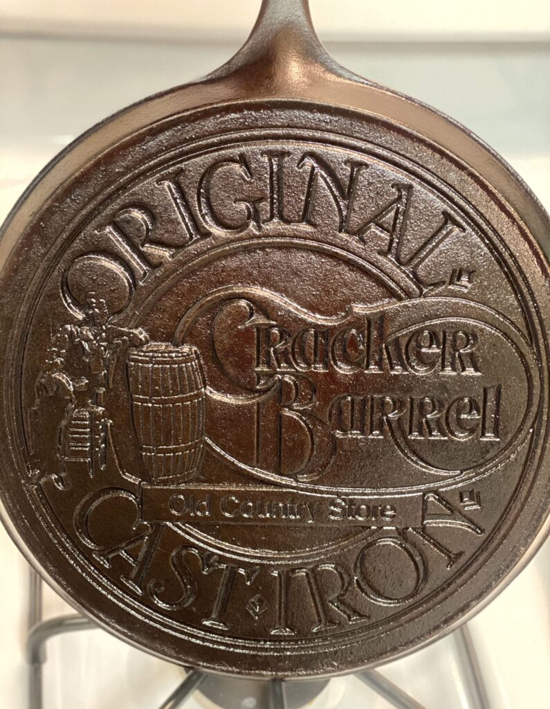 a well seasoned vintage Cracker Barrel logo skillet