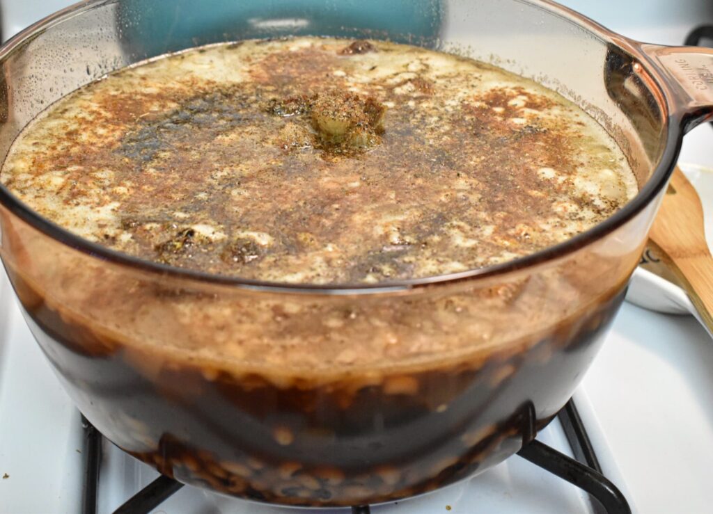 southern black eyed peas with creole seasoning in a clear pot