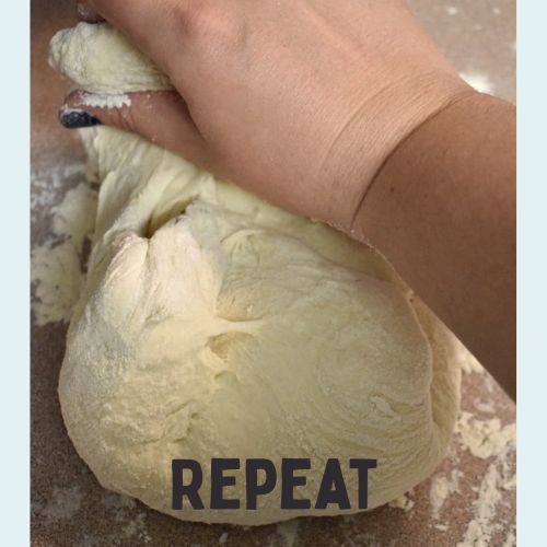 hand kneading sourdough on a countertop