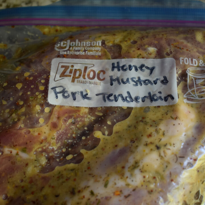 a gallon ziplock labeled honey mustard pork tenderloin full of meat and seasonings