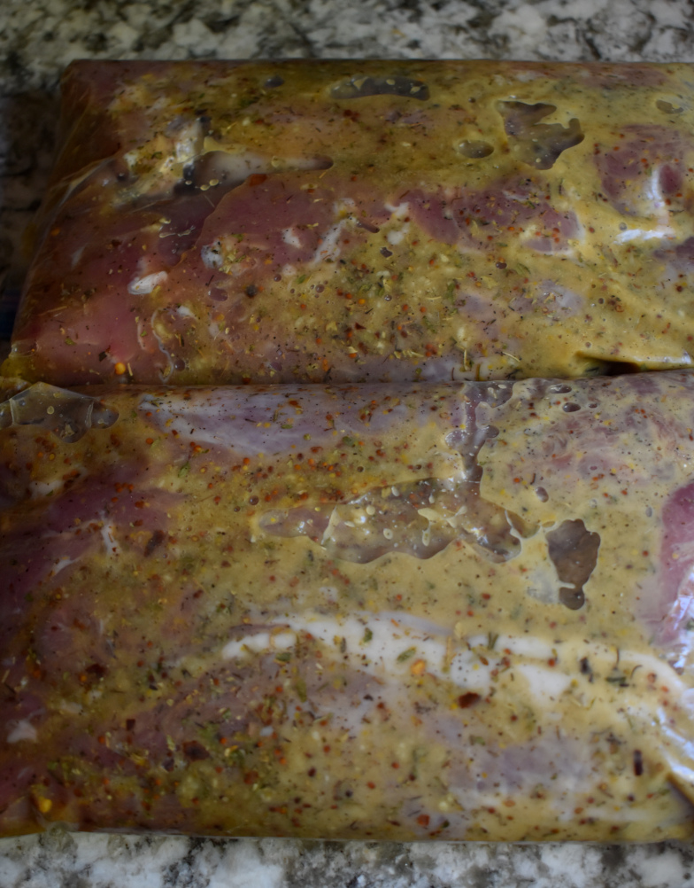 honey mustard marinade rubbed over pork tenderloin in two ziplock bags